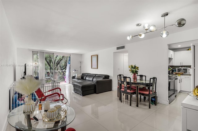 living area featuring light tile patterned floors and visible vents