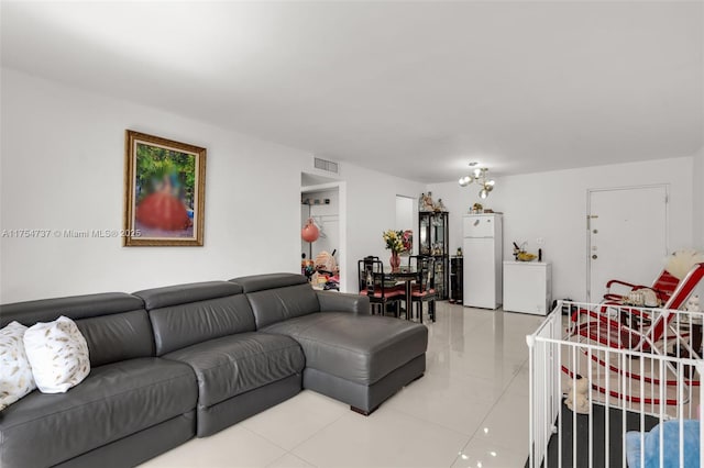 living area with light tile patterned floors and visible vents