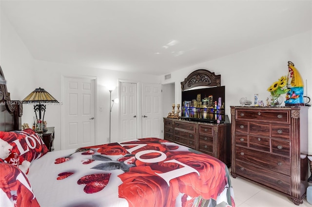 bedroom featuring visible vents