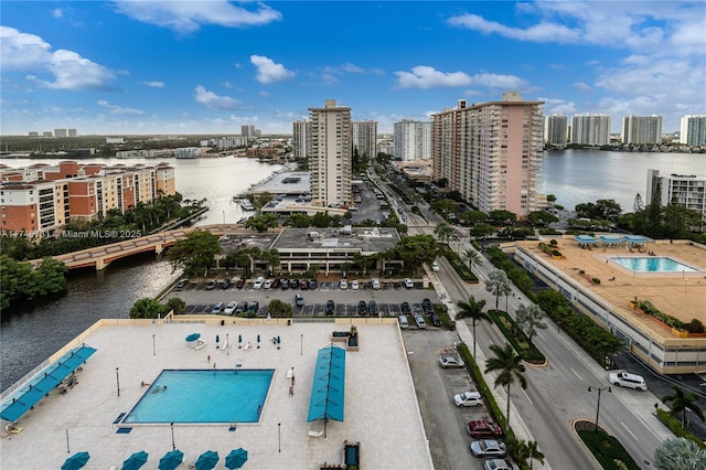 bird's eye view featuring a water view and a city view