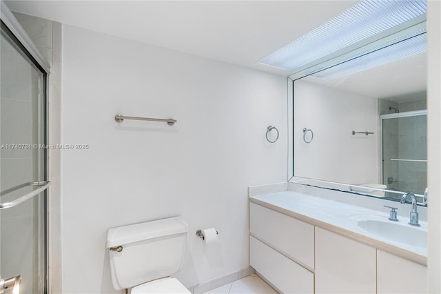 full bathroom featuring tile patterned flooring, vanity, toilet, and an enclosed shower