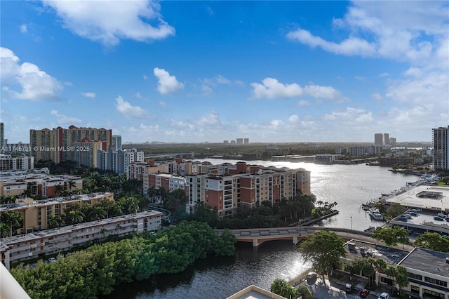 birds eye view of property featuring a view of city and a water view