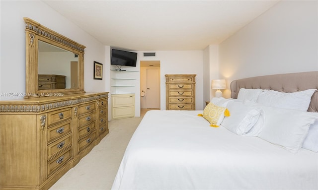 bedroom featuring light carpet and visible vents