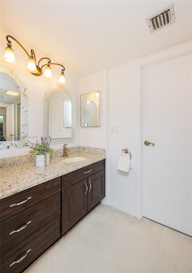 bathroom with visible vents and vanity