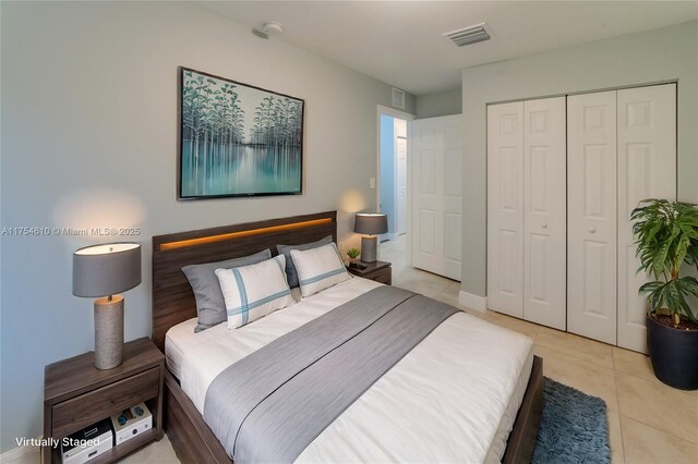 1955 NW 5th Pl Unit 13, Miami, FL 33136 - bedroom featuring light tile patterned floors, visible vents, and a closet