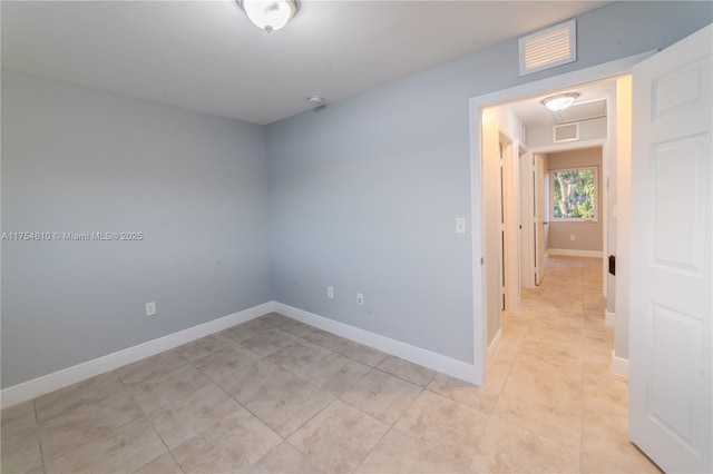 1955 NW 5th Pl Unit 13, Miami, FL 33136 - spare room with visible vents, baseboards, and light tile patterned flooring