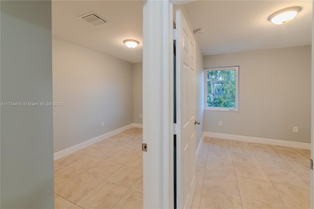 1955 NW 5th Pl Unit 13, Miami, FL 33136 - corridor with light tile patterned flooring, visible vents, and baseboards