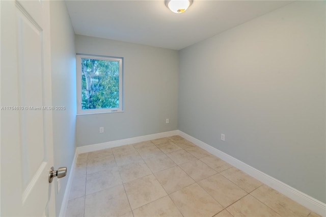 1955 NW 5th Pl Unit 13, Miami, FL 33136 - empty room featuring baseboards and light tile patterned floors