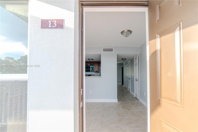 1955 NW 5th Pl Unit 13, Miami, FL 33136 - corridor with baseboards, visible vents, and light tile patterned flooring