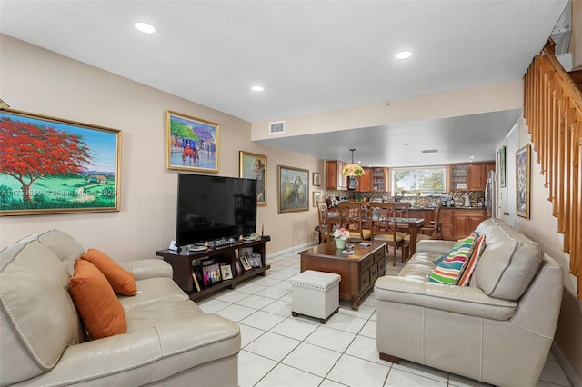 living room featuring recessed lighting, visible vents, baseboards, and light tile patterned floors