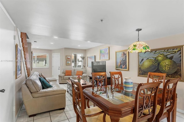 dining area with light tile patterned floors and recessed lighting