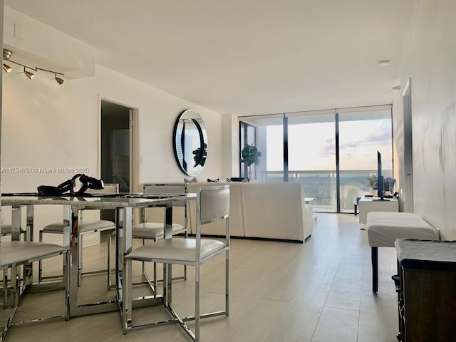 dining area with floor to ceiling windows