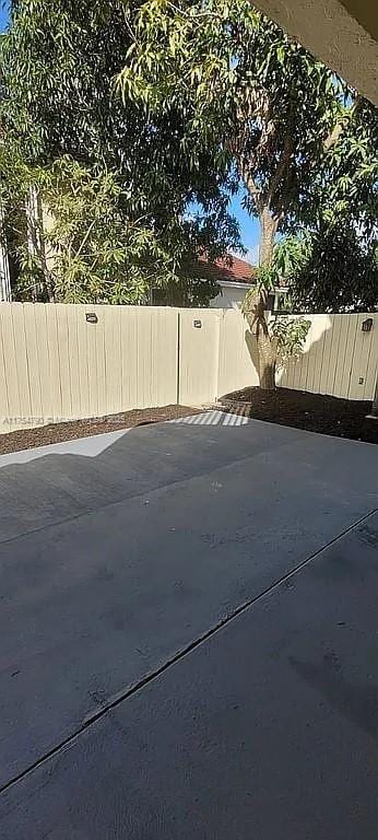 exterior space with concrete driveway