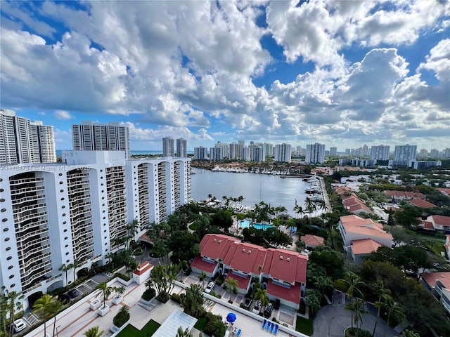 birds eye view of property featuring a view of city and a water view