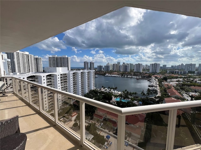 balcony featuring a view of city and a water view