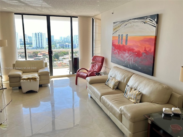 living room with expansive windows, a textured ceiling, a city view, and light tile patterned flooring