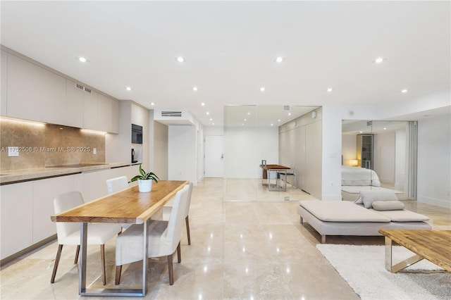 dining room featuring marble finish floor, baseboards, visible vents, and recessed lighting