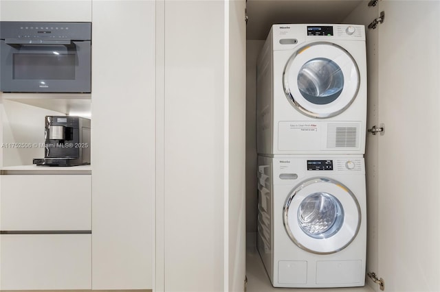 washroom with stacked washer and dryer