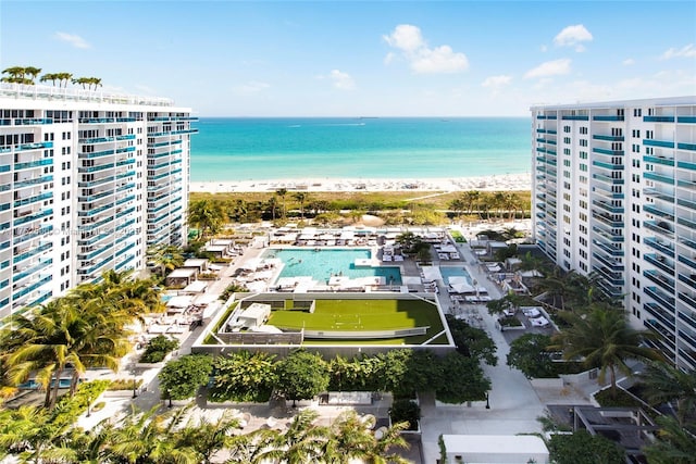 aerial view with a water view and a view of the beach