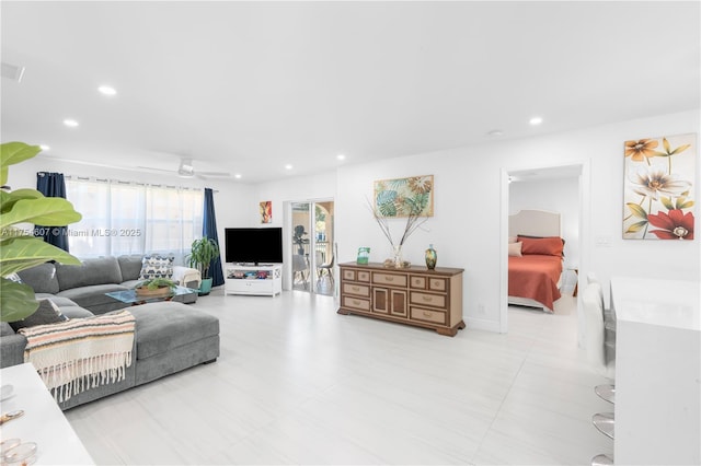 living room with visible vents, a ceiling fan, and recessed lighting