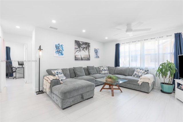 living room featuring a ceiling fan, visible vents, and recessed lighting