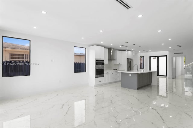 3430 SW 2nd St, Miami, FL 33135 - kitchen featuring recessed lighting, marble finish floor, wall chimney exhaust hood, and open floor plan