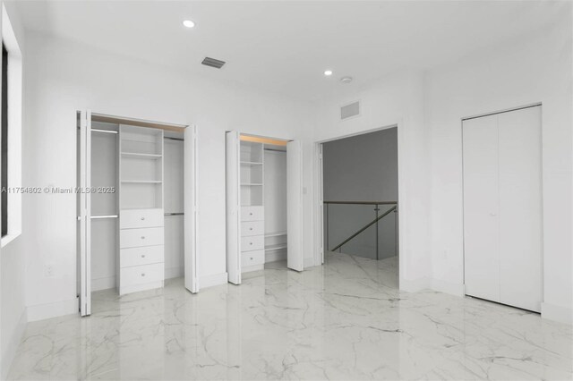 3430 SW 2nd St, Miami, FL 33135 - unfurnished bedroom featuring marble finish floor, visible vents, multiple closets, and recessed lighting
