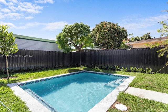 3430 SW 2nd St, Miami, FL 33135 - view of swimming pool with a fenced backyard, a fenced in pool, and a yard