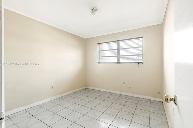 unfurnished room with ornamental molding and baseboards