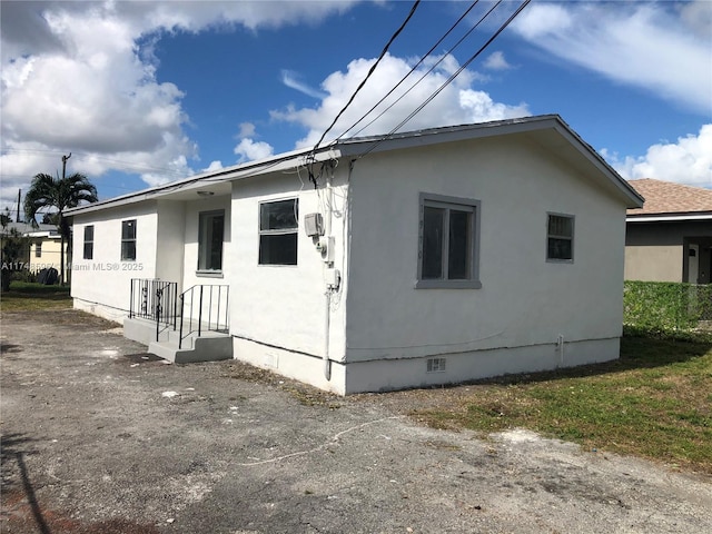 view of property exterior featuring crawl space