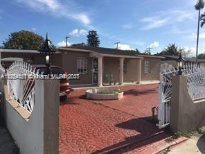 view of front of home featuring fence