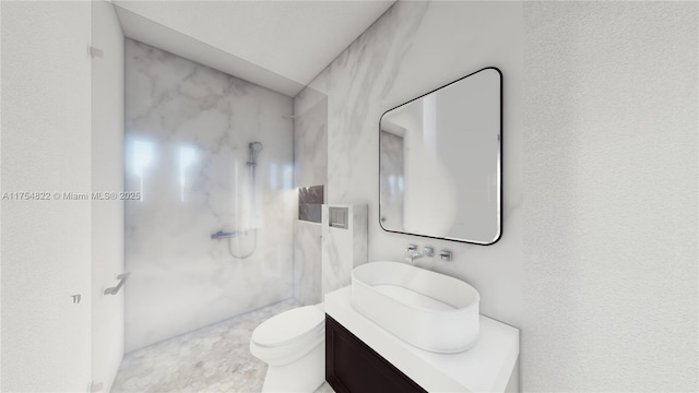 full bathroom featuring toilet, a marble finish shower, and vanity