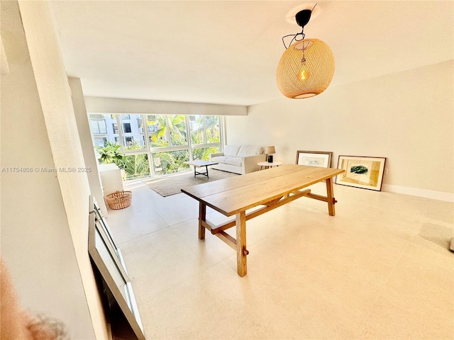 dining space with tile patterned floors and baseboards