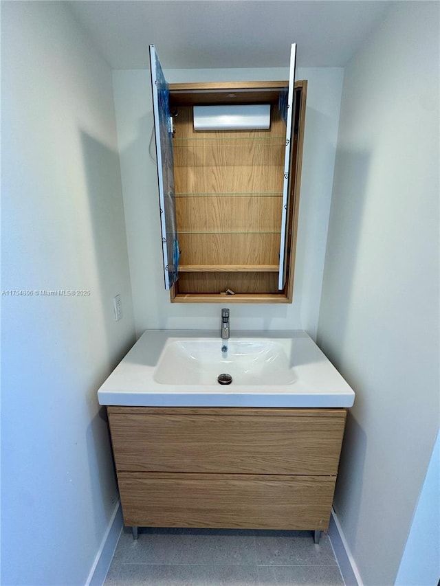 555 Crandon Blvd Unit 32, Key Biscayne, FL 33149 - bathroom featuring baseboards and vanity