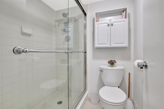 full bath with toilet and a stall shower