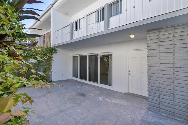 view of patio featuring a balcony