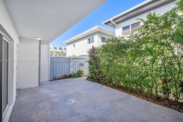 view of patio / terrace featuring fence