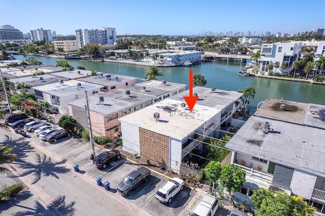 drone / aerial view with a water view and a city view