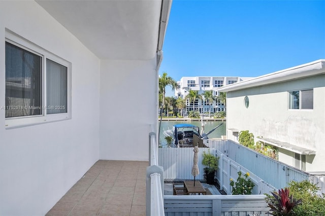 balcony featuring a water view