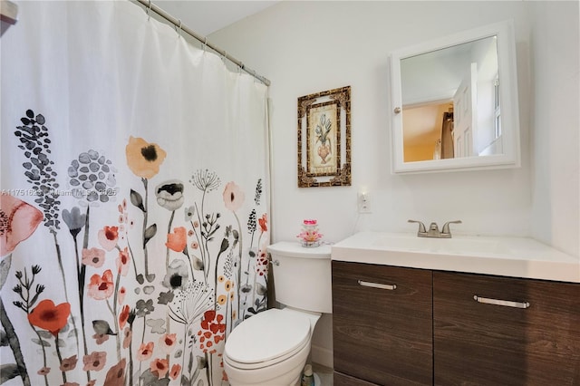 bathroom featuring vanity, toilet, and a shower with curtain