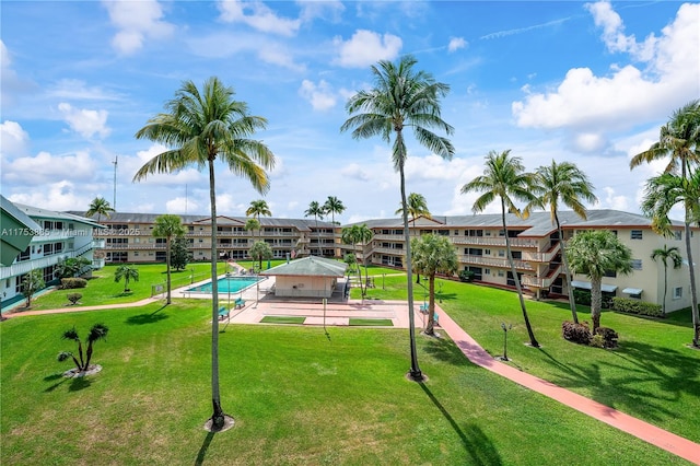 view of home's community featuring a lawn