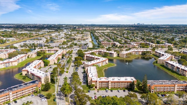 bird's eye view featuring a view of city and a water view