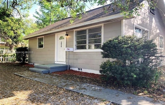 view of exterior entry with fence