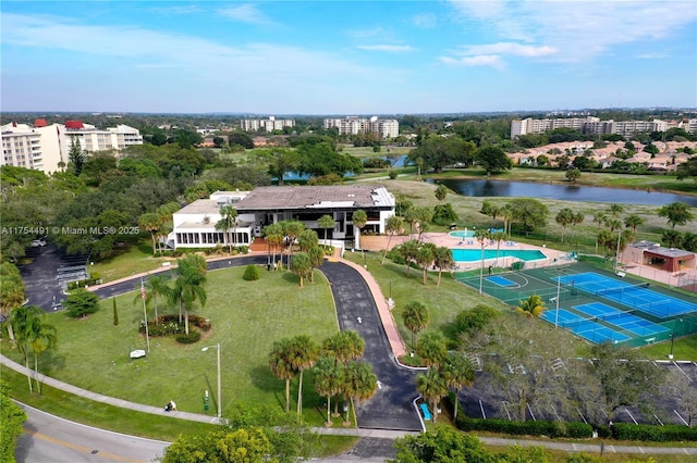 drone / aerial view featuring a water view and a city view