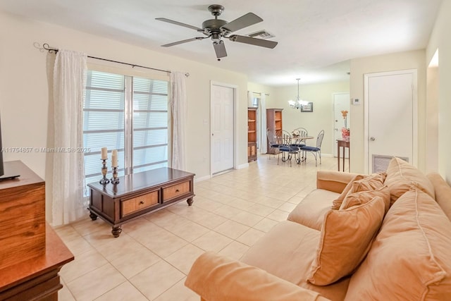 living area with visible vents, baseboards, and light tile patterned floors