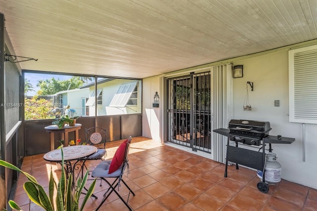 sunroom with wooden ceiling