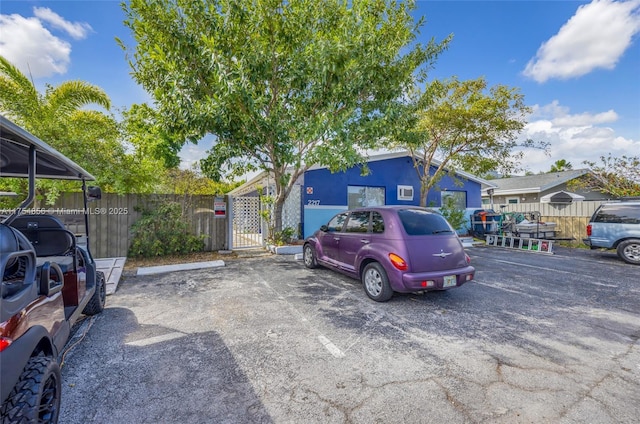 2217 NE 14th Ave, Wilton Manors, FL 33305 - uncovered parking lot with a gate and fence
