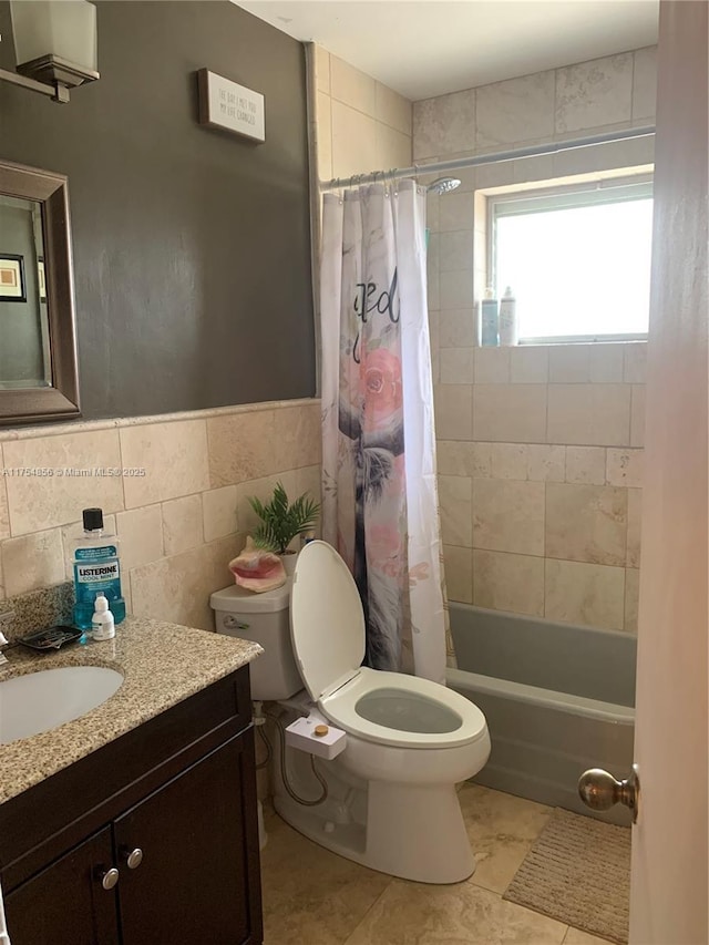 2217 NE 14th Ave, Wilton Manors, FL 33305 - bathroom with tile patterned flooring, toilet, vanity, tile walls, and shower / bath combo