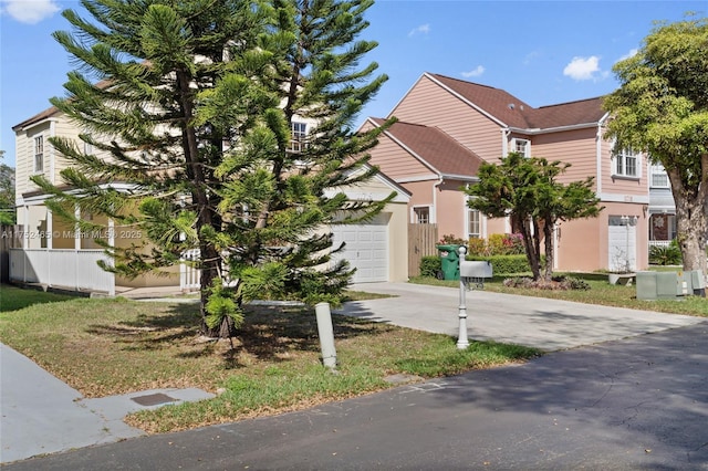 view of front of house with a garage and concrete driveway