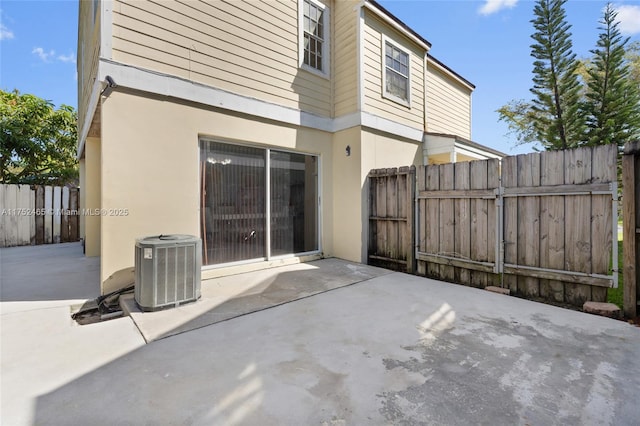 view of patio / terrace featuring central AC and fence